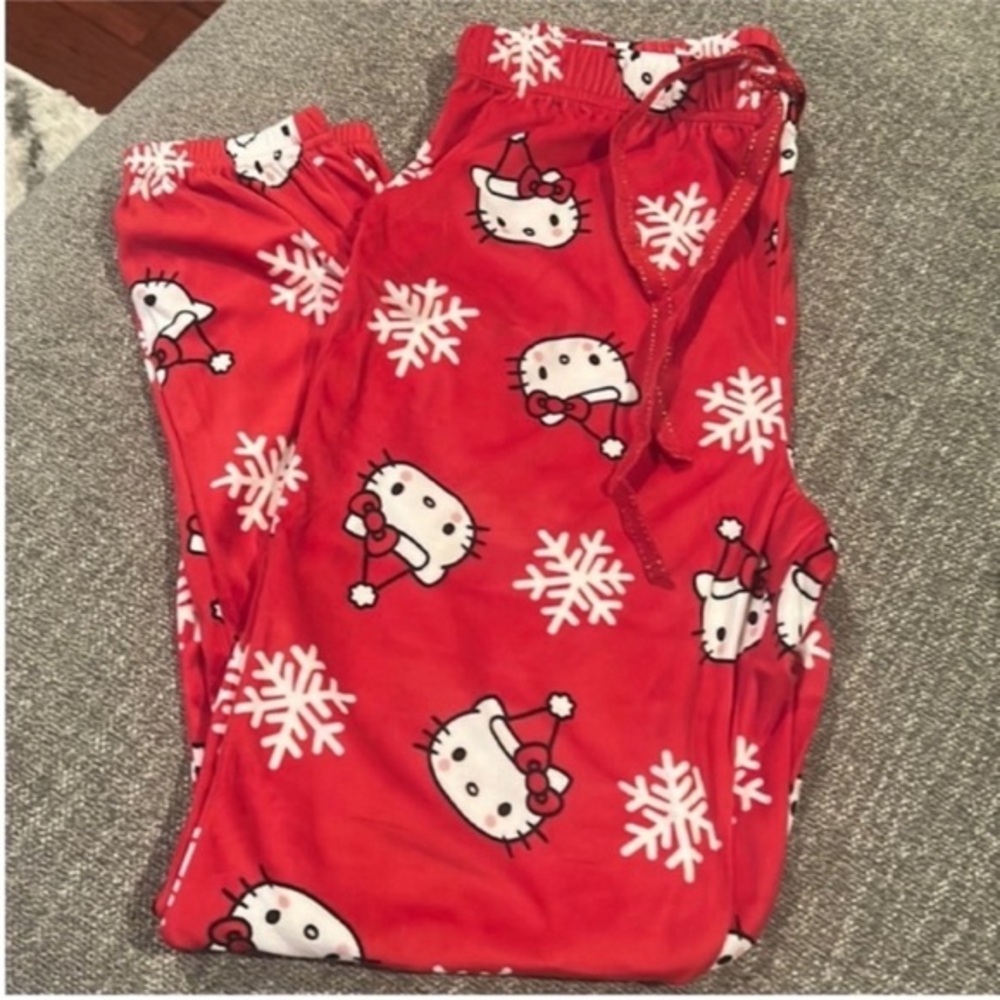 Small hello Kitty Christmas Pajamas 
Pajama pants 
Santa hat